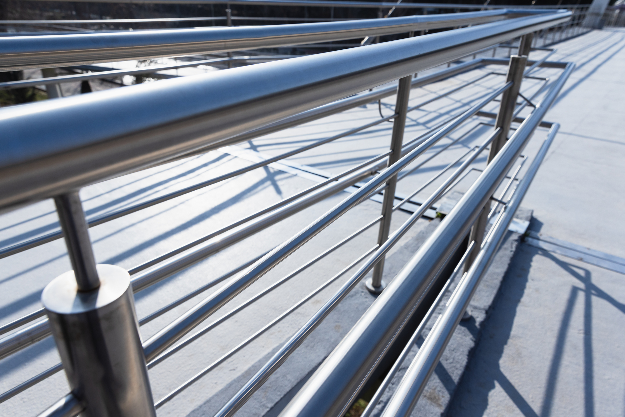Perspective view of a polished stainless steel railing